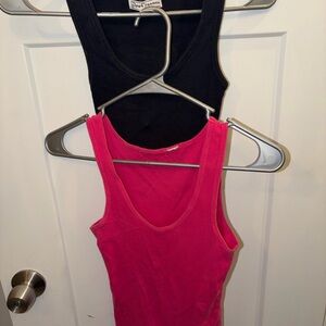 A pink and a black tank top